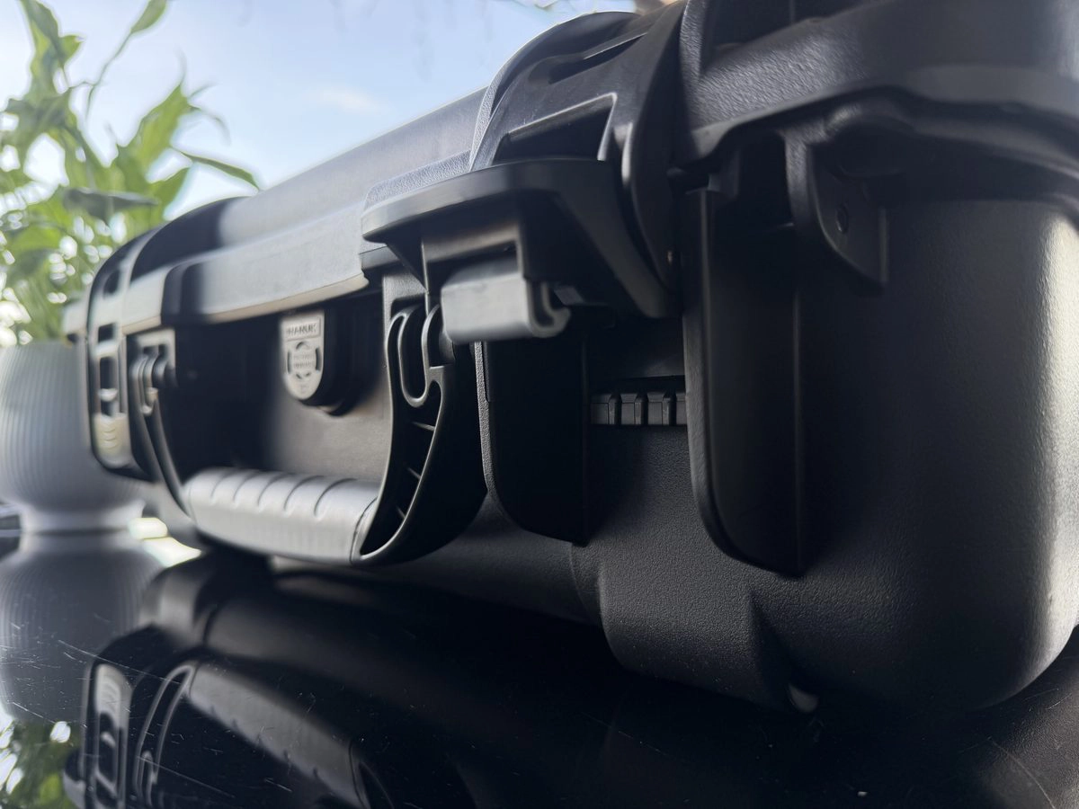 Close-up of Nanuk 925 PowerClaw latch in open position showing lock hole and mechanism detail