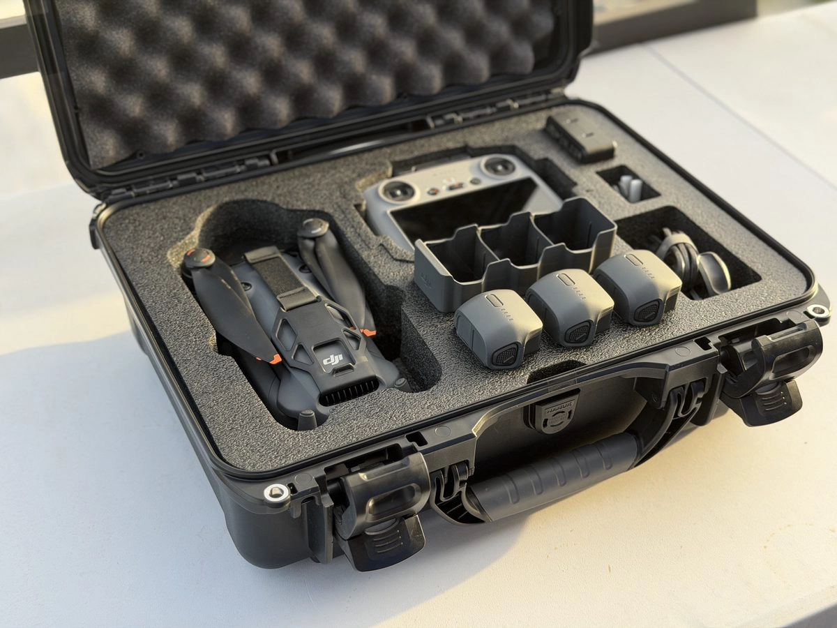 Nanuk 925 open with full DJI Mavic 4 Pro Fly More kit loaded: drone, controller, three batteries, charger, and cables all seated in precision foam cutouts