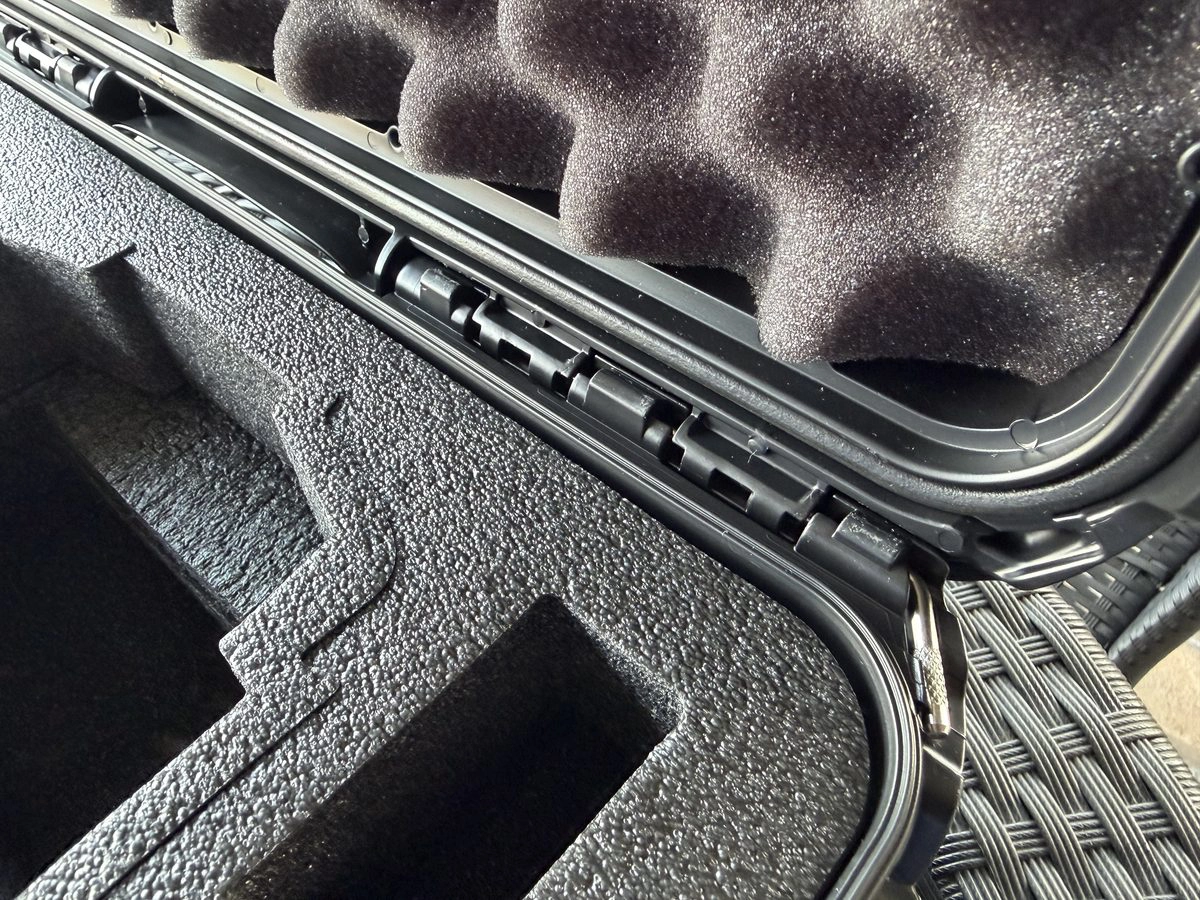 Nanuk 925 lid open showing continuous piano-style hinge mechanism and foam interior detail