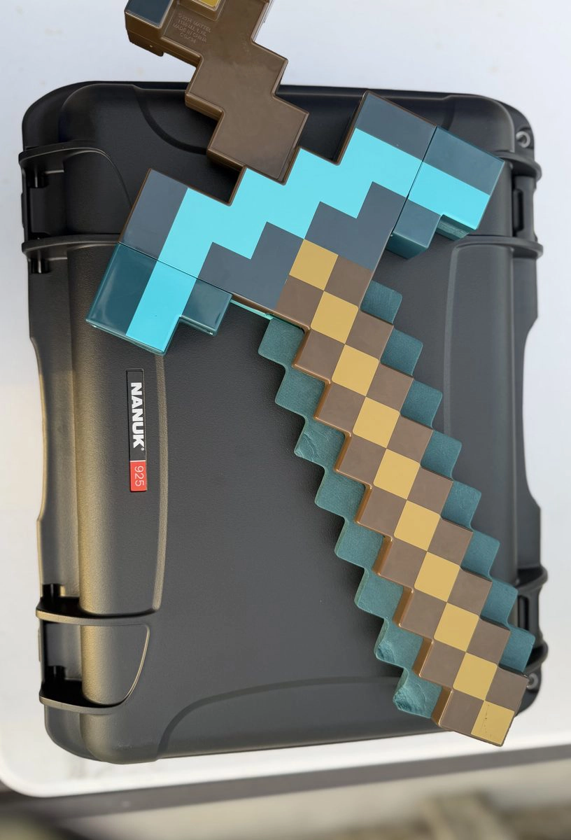 Minecraft diamond sword laid across the Nanuk 925 case exterior